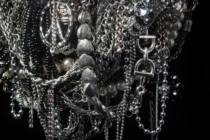 A close-up of pile of jewelry, part of portable sculpture Treasure
