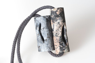 Close-up of granite necklace Secrets II by Hanna Ryynänen