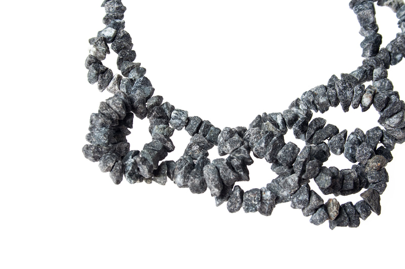 Detail of a granite necklace made by Hanna Ryynänen