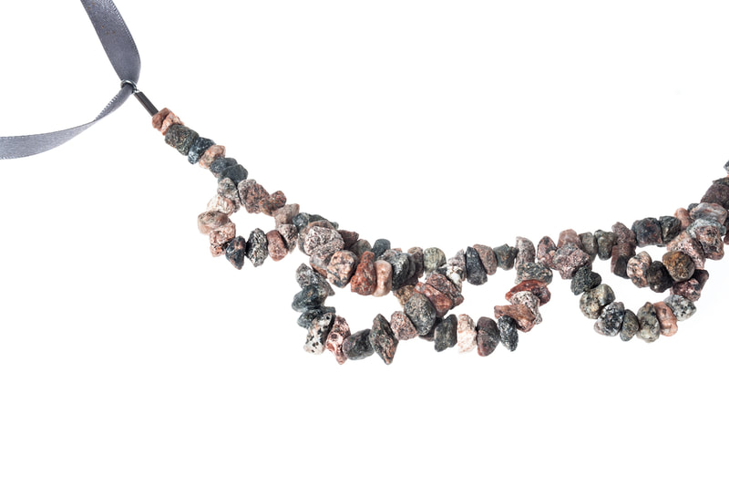 Detail of a granite necklace by Hanna Ryynänen