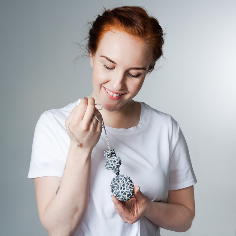 Granite pendant on model by Hanna Ryynänen